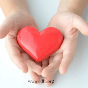 Two hands cupping a glossy red heart, symbolizing care, with cdhi.org watermark at the bottom.